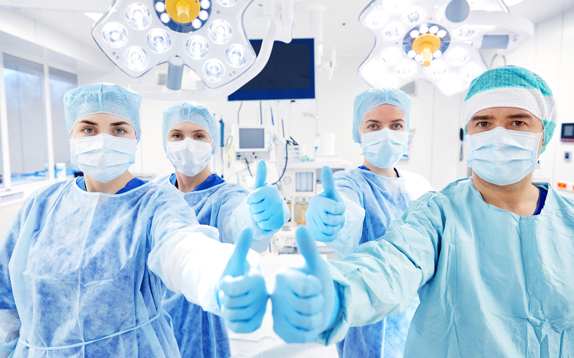 Group of Surgeons in Operating Room at Hospital